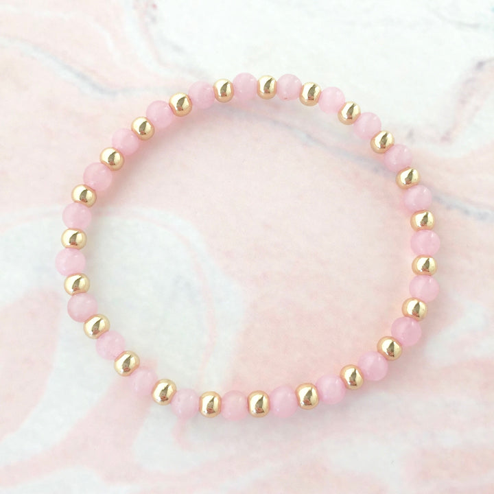 Power rose quartz gold ball bracelet